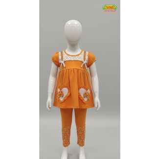 Bright orange kids tunic and printed leggings set displayed on a mannequin in India