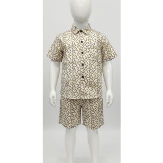 Child mannequin modeling an off-white and olive green printed short sleeve shirt and matching shorts set
