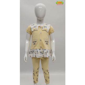 Pale yellow girls two-piece top and legging set with floral print accents on a white mannequin.