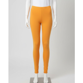 Mannequin wearing solid mango color 4-way cotton stretch ankle length leggings