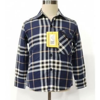 Navy blue, black, and cream plaid long sleeve button-up shirt on a mannequin
