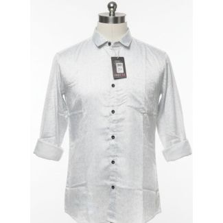 White button-down shirt with dotted pattern, long sleeves with folded cuffs.