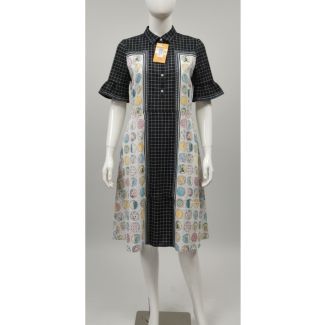 Woman's mannequin wearing a knee-length cotton dress with black grid and pastel circle print