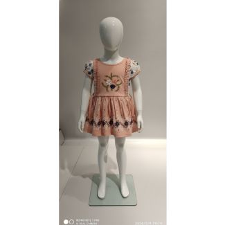 Peach floral print kids cotton dress with short puff sleeves on a mannequin in India