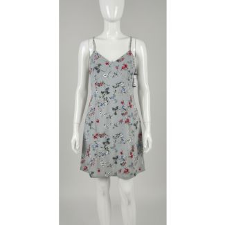 Light grey floral print mini dress with adjustable spaghetti straps on a mannequin