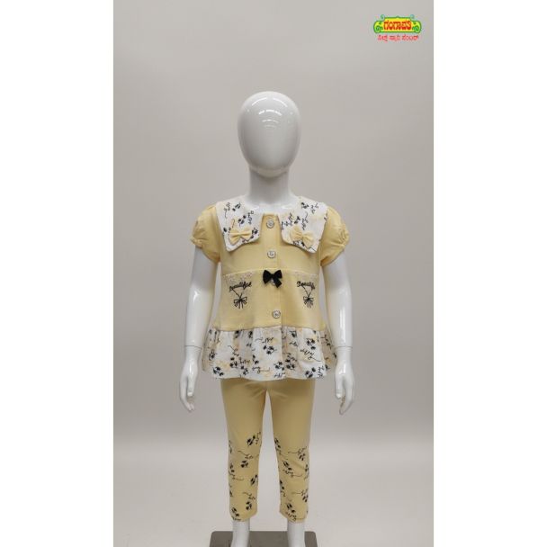 Yellow floral print tunic and slim pant set on a child mannequin India