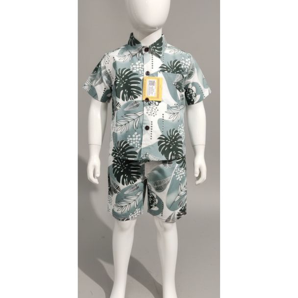 White and green tropical leaf print short sleeve shirt and shorts set for boys on mannequin