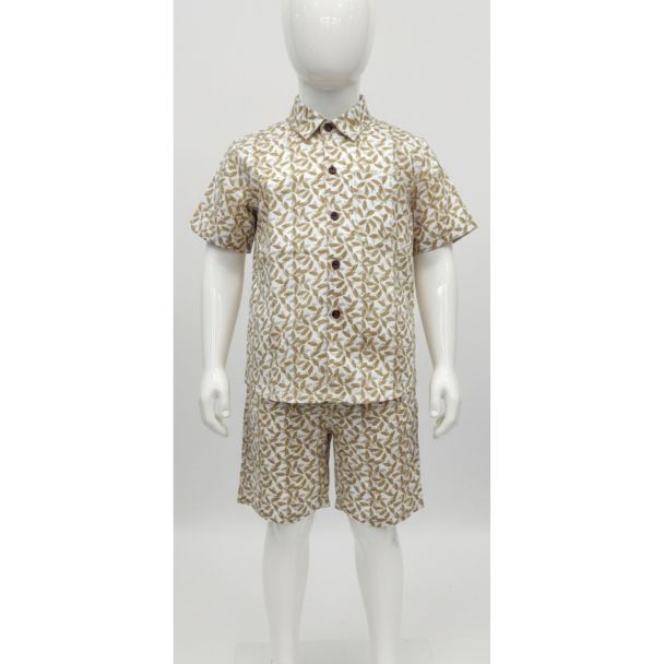 Child mannequin modeling an off-white and olive green printed short sleeve shirt and matching shorts set