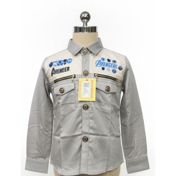 Light grey boy's shirt with blue character graphics, full sleeves, and decorative buttons.