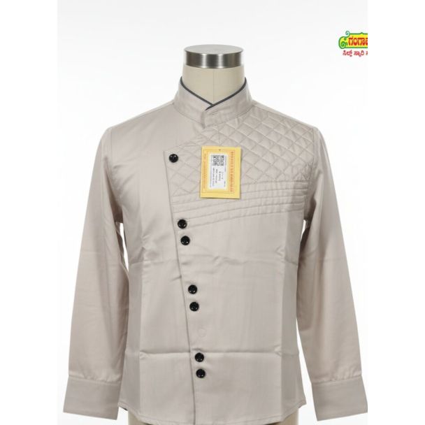 Light beige uniform top with quilted right chest, mandarin collar, and diagonal black buttons.