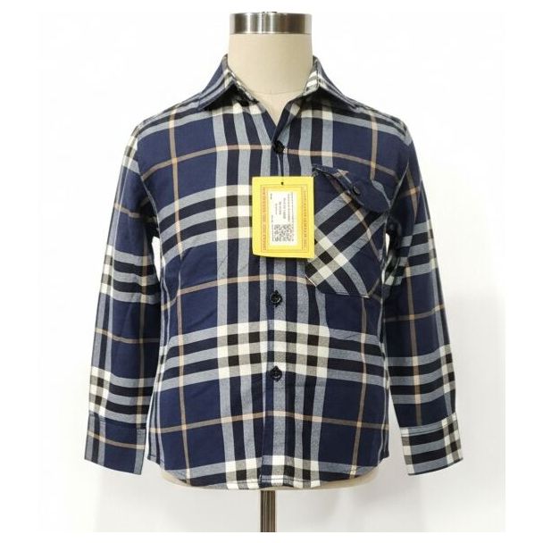 Navy blue, black, and cream plaid long sleeve button-up shirt on a mannequin