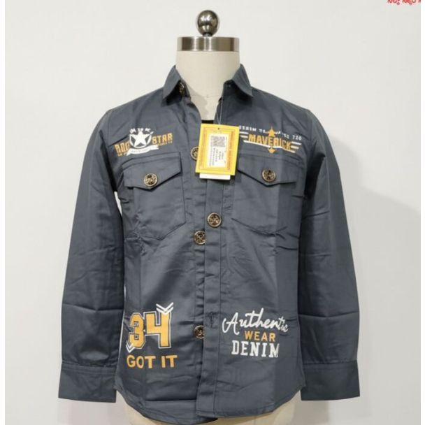 Charcoal gray long sleeve button-up shirt with graphic prints on a mannequin.