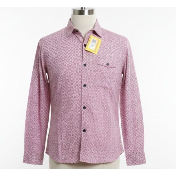 Pink patterned cotton shirt with long sleeves and dark buttons on a mannequin.