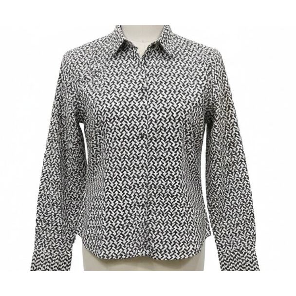 Black and white geometric print cotton shirt with long sleeves and a collared neckline.