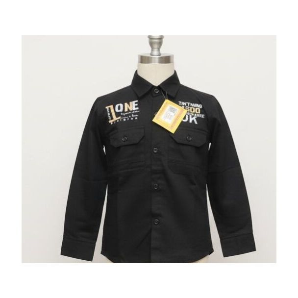 Close-up of a black long-sleeved collared shirt with graphic text prints on the chest.