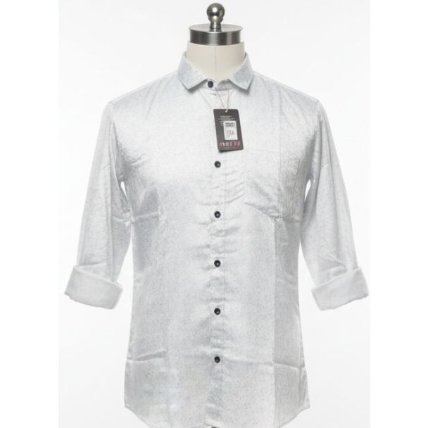 White button-down shirt with dotted pattern, long sleeves with folded cuffs.