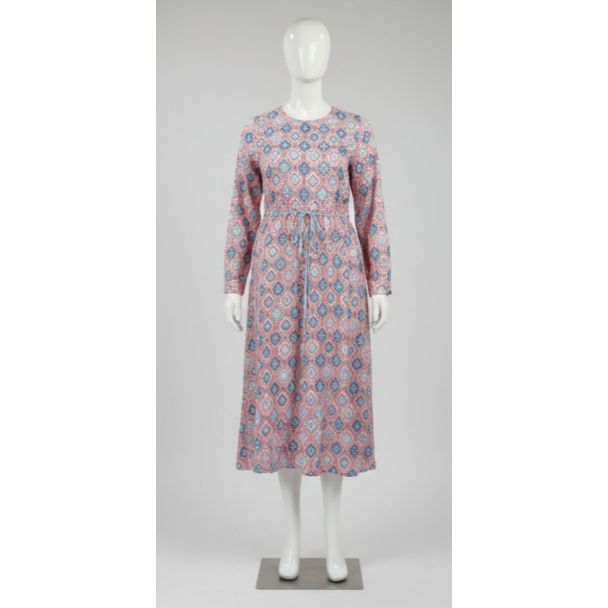 Pink geometric print cotton maxi dress with long sleeves and drawstring waist, displayed on a mannequin.