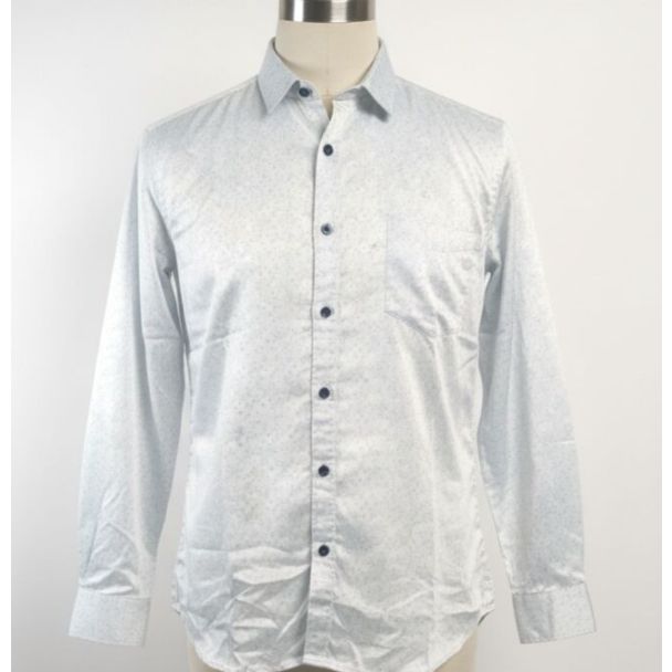 Light blue men's shirt with a dotted pattern, long sleeves and a collar.