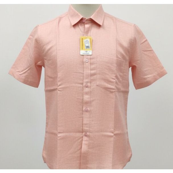 Light salmon pink solid cotton short sleeve collared shirt displayed on mannequin.