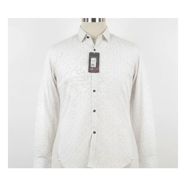 White cotton shirt with small grey print, long sleeves, and a button-down collar.